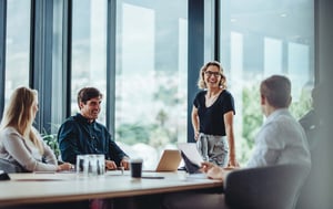 team-at-conference-room-table-laughing-1